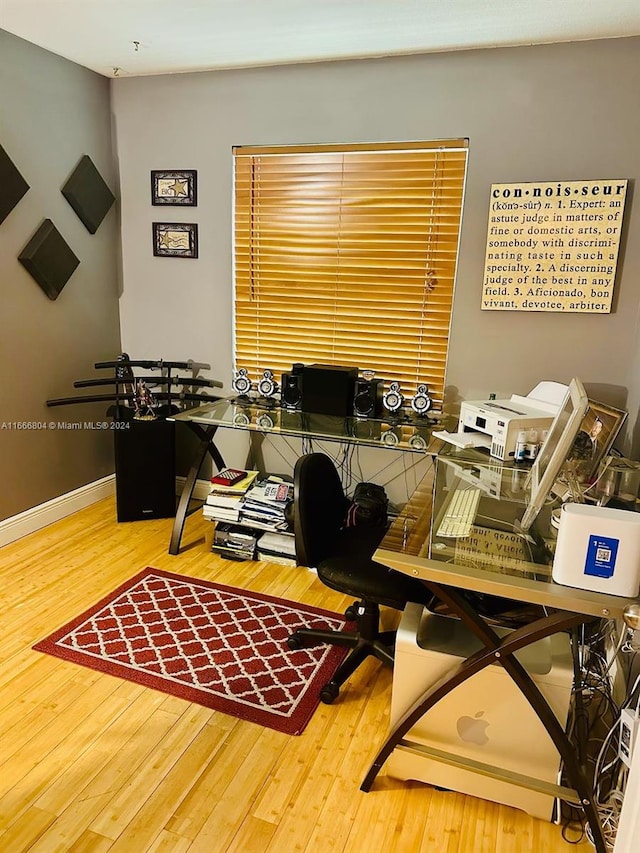 home office with wood-type flooring