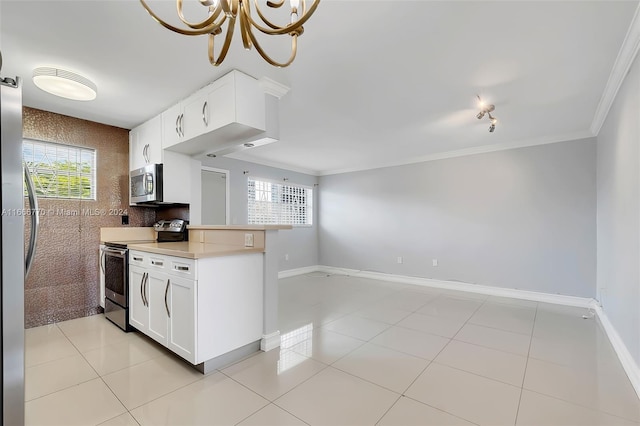 kitchen featuring stainless steel appliances, white cabinets, plenty of natural light, and crown molding