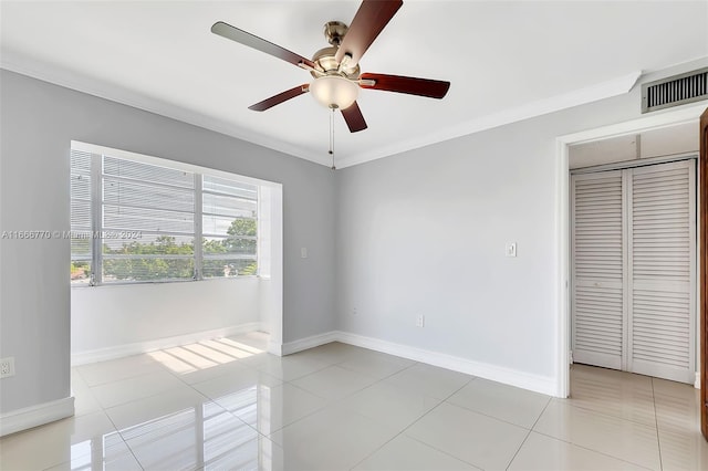 2496 SW 17th Ave Unit 5307, Miami, FL 33145 - unfurnished room featuring ceiling fan, baseboards, light tile patterned flooring, and crown molding
