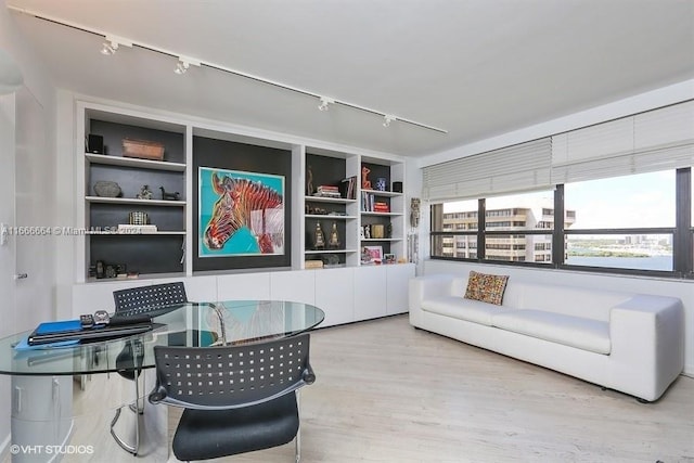2 Grove Isle Dr Unit B1708, Miami, FL 33133 - living area featuring rail lighting, wood finished floors, and built in shelves