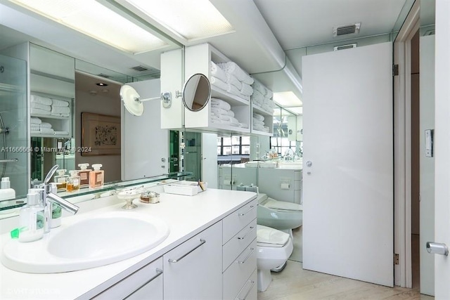 2 Grove Isle Dr Unit B1708, Miami, FL 33133 - bathroom with vanity and wood finished floors