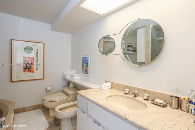 2 Grove Isle Dr Unit B1708, Miami, FL 33133 - bathroom featuring a bidet, vanity, a tub to relax in, and tile patterned floors
