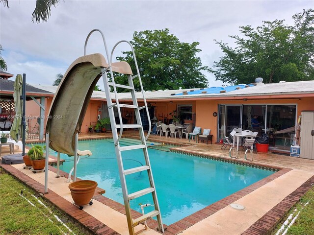 view of pool featuring a patio