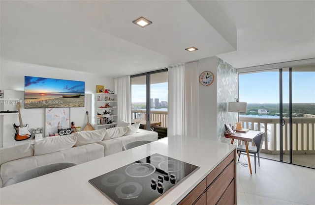 tiled living room featuring expansive windows