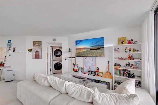 living room featuring stacked washing maching and dryer