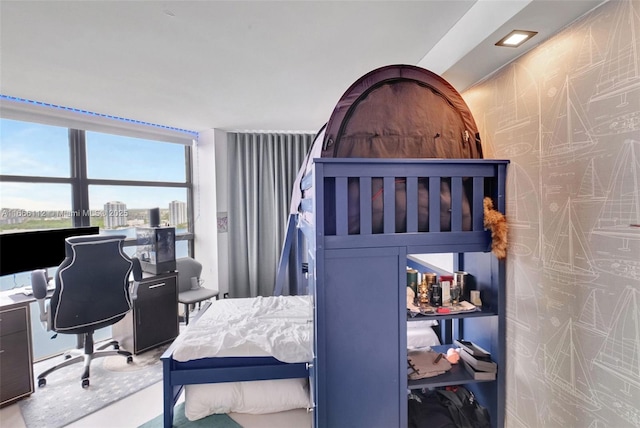bedroom featuring floor to ceiling windows