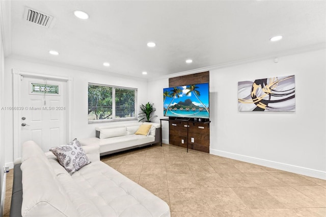 tiled living room featuring crown molding