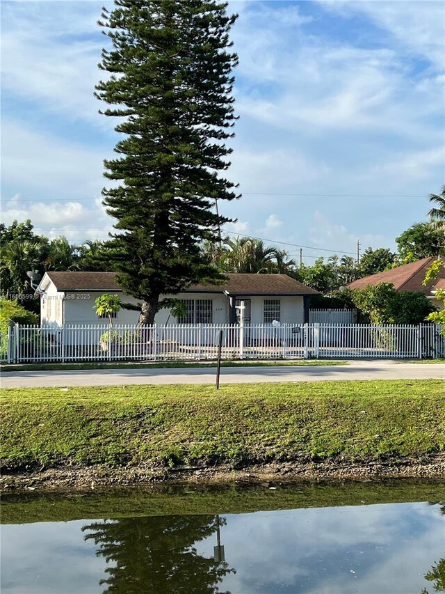 back of property with a water view