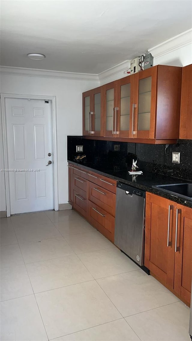 kitchen with tasteful backsplash, light tile patterned floors, ornamental molding, and dishwasher