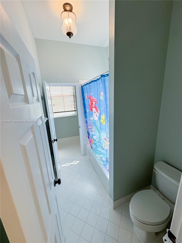 bathroom with toilet, walk in shower, and tile patterned floors