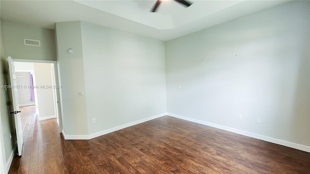 spare room featuring dark hardwood / wood-style flooring