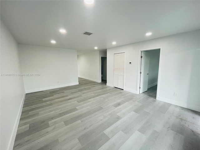 empty room with light hardwood / wood-style floors