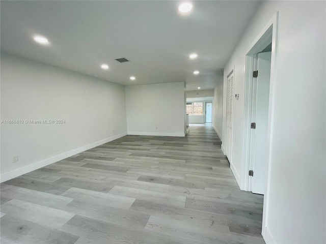 hallway with light wood-type flooring