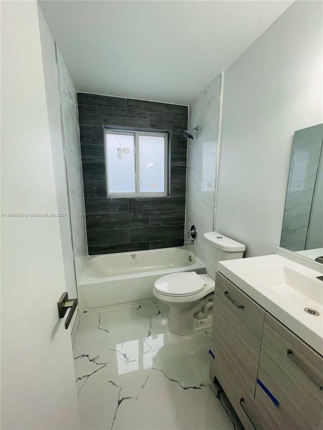 full bathroom with vanity, toilet, and tiled shower / bath