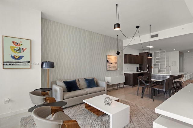 living room featuring light hardwood / wood-style floors and sink