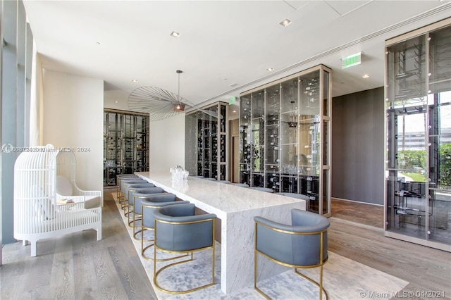 wine room with light hardwood / wood-style flooring