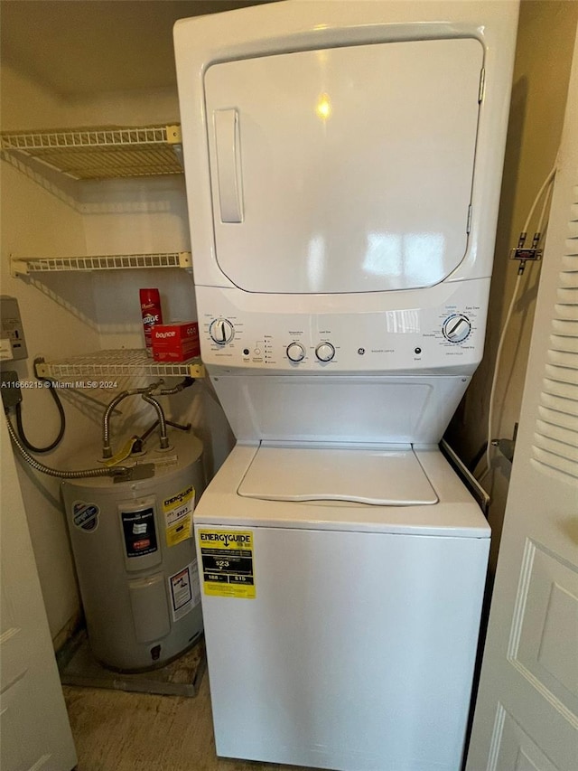 laundry area featuring stacked washer and clothes dryer and water heater