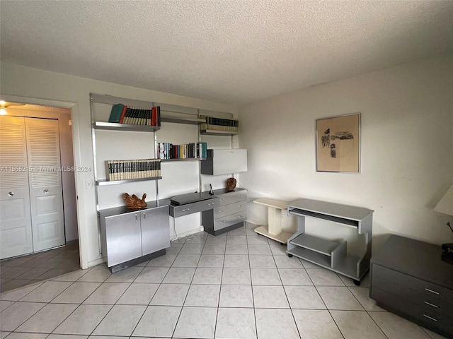 tiled office with a textured ceiling