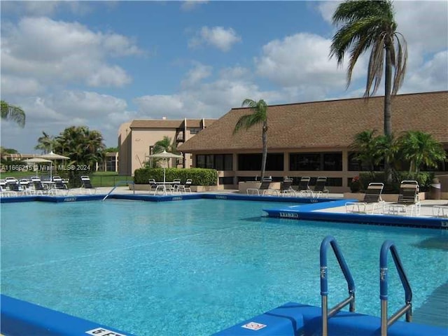 view of swimming pool featuring a patio area