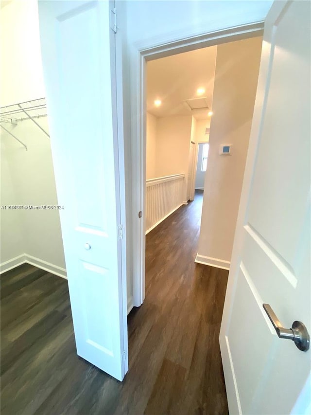 corridor featuring dark hardwood / wood-style floors