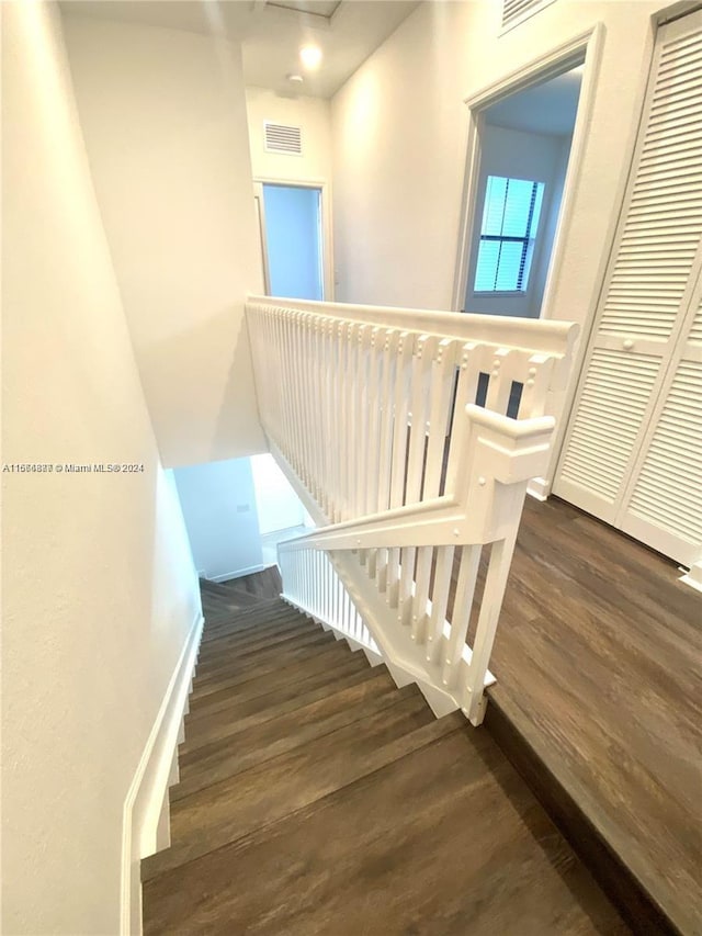 staircase featuring hardwood / wood-style floors