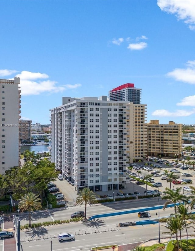 view of property featuring a city view and a water view