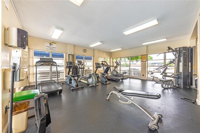 exercise room with a textured ceiling