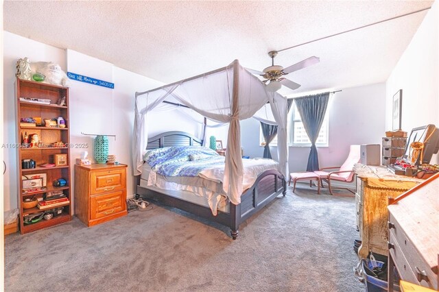 bedroom with a textured ceiling, ceiling fan, and dark colored carpet