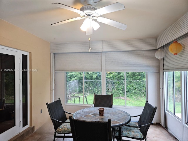 interior space with ceiling fan