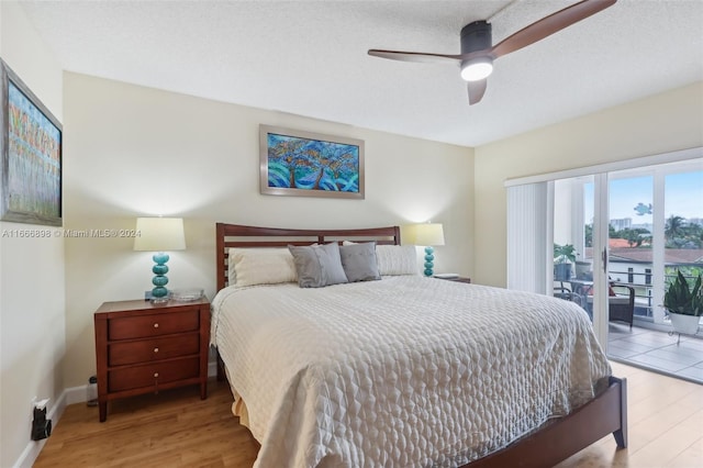 bedroom featuring ceiling fan, access to exterior, a textured ceiling, and light wood-type flooring