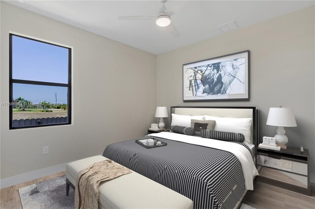 bedroom featuring hardwood / wood-style floors and ceiling fan