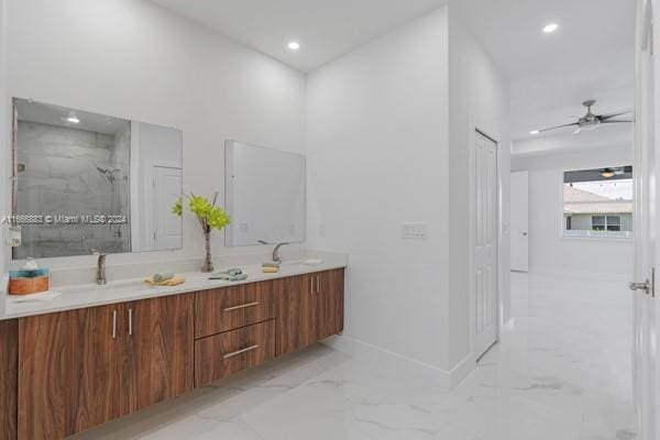 bathroom featuring vanity, ceiling fan, and a shower with shower door