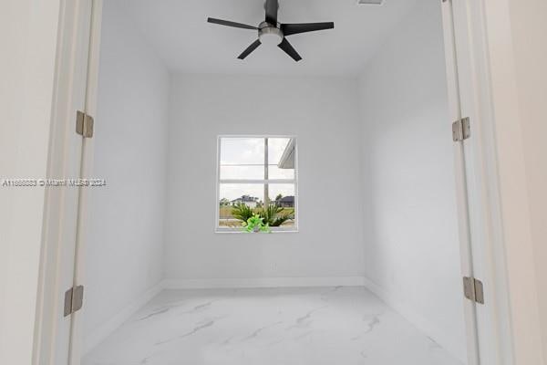 empty room featuring ceiling fan