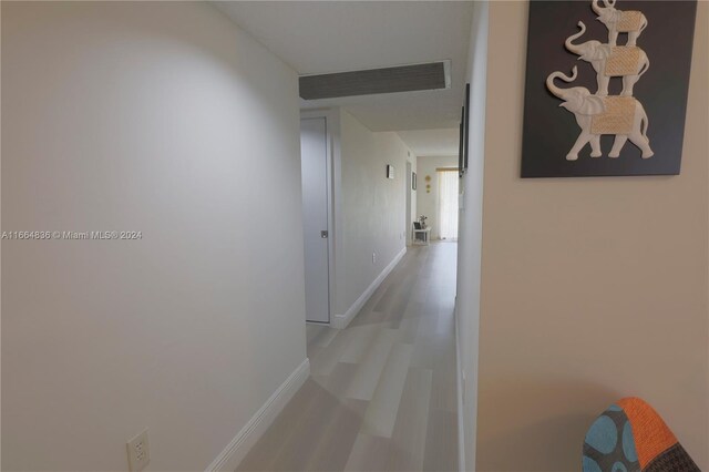 12750 SW 15th St Unit 106D, Pembroke Pines, FL 33027 - hall featuring baseboards and light wood-style flooring