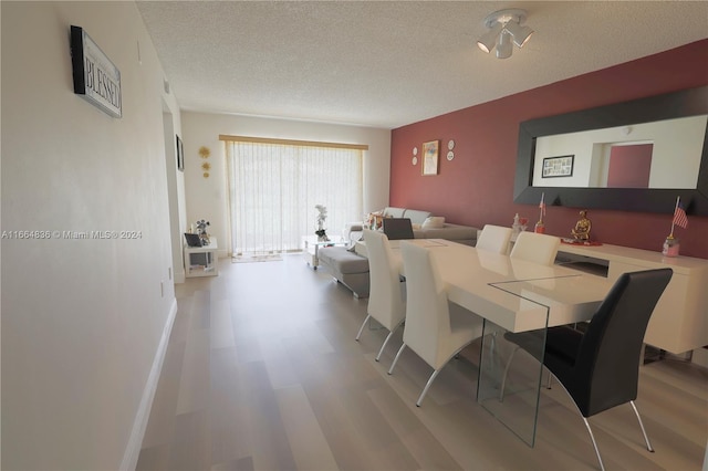 dining area with a textured ceiling