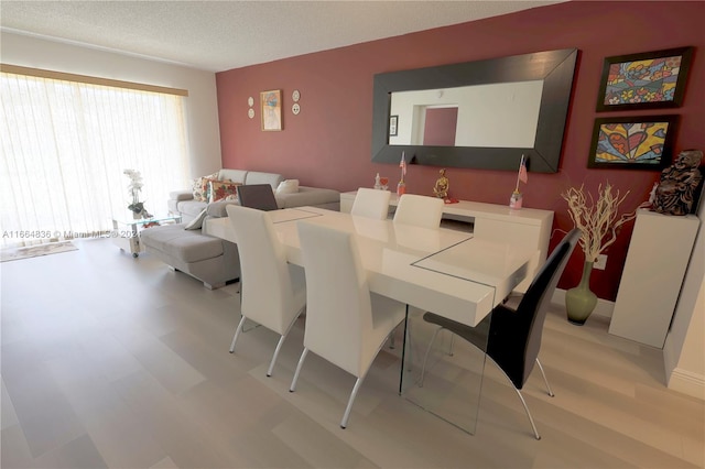 dining area with a textured ceiling