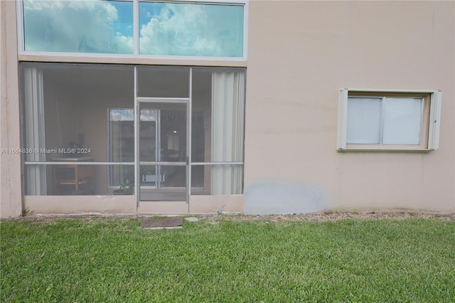 12750 SW 15th St Unit 106D, Pembroke Pines, FL 33027 - view of side of property with stucco siding and a yard