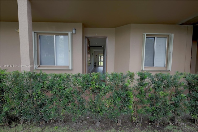 12750 SW 15th St Unit 106D, Pembroke Pines, FL 33027 - doorway to property featuring stucco siding