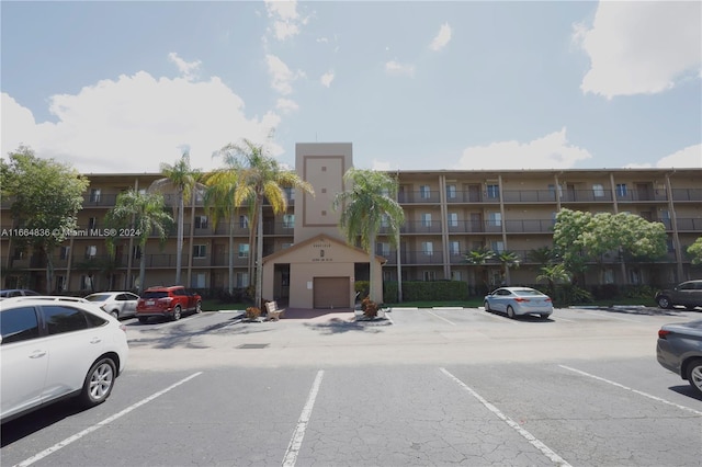 12750 SW 15th St Unit 106D, Pembroke Pines, FL 33027 - view of apartment building / complex with uncovered parking