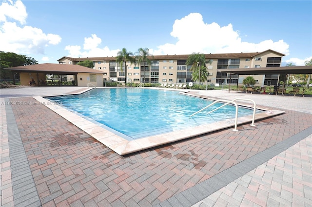 12750 SW 15th St Unit 106D, Pembroke Pines, FL 33027 - community pool featuring a patio