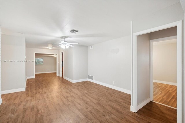 unfurnished room with ceiling fan and light hardwood / wood-style floors