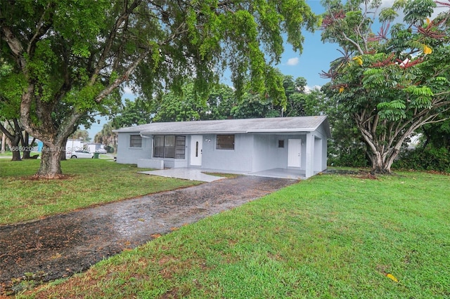 single story home with a front yard