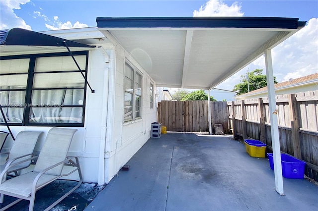 view of side of property with a patio