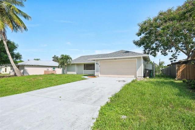 single story home featuring a garage and a front lawn