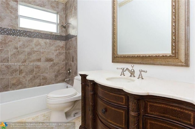 full bathroom with tile patterned flooring, vanity, toilet, and tiled shower / bath