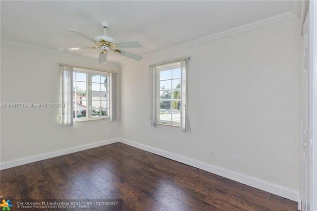 empty room featuring ceiling fan, crown molding, and dark hardwood / wood-style flooring