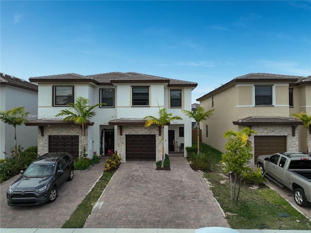 view of front of property with a garage