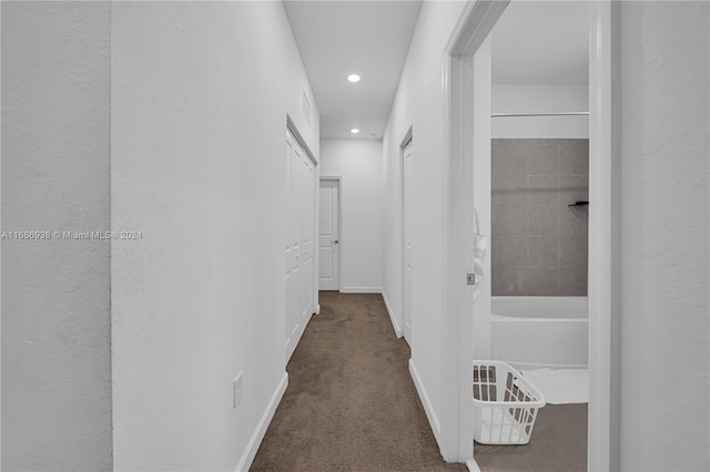 corridor with dark colored carpet