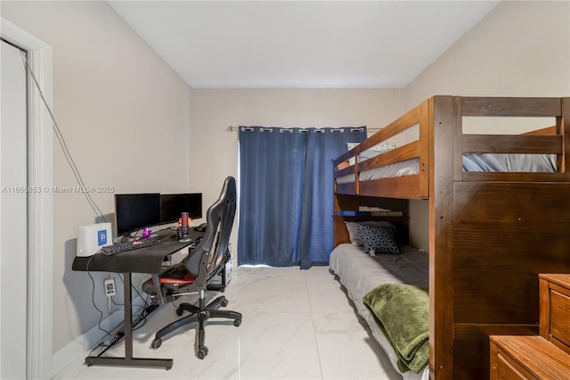 bedroom featuring marble finish floor