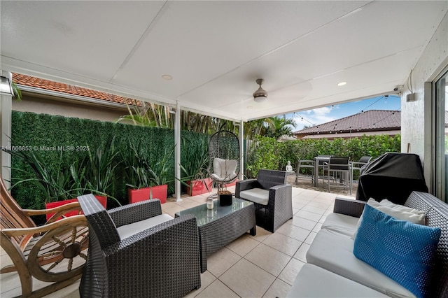 view of patio with outdoor dining area, outdoor lounge area, fence, and ceiling fan